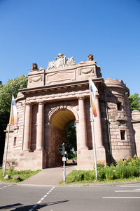 Low angle view of historical building against clear blue sky