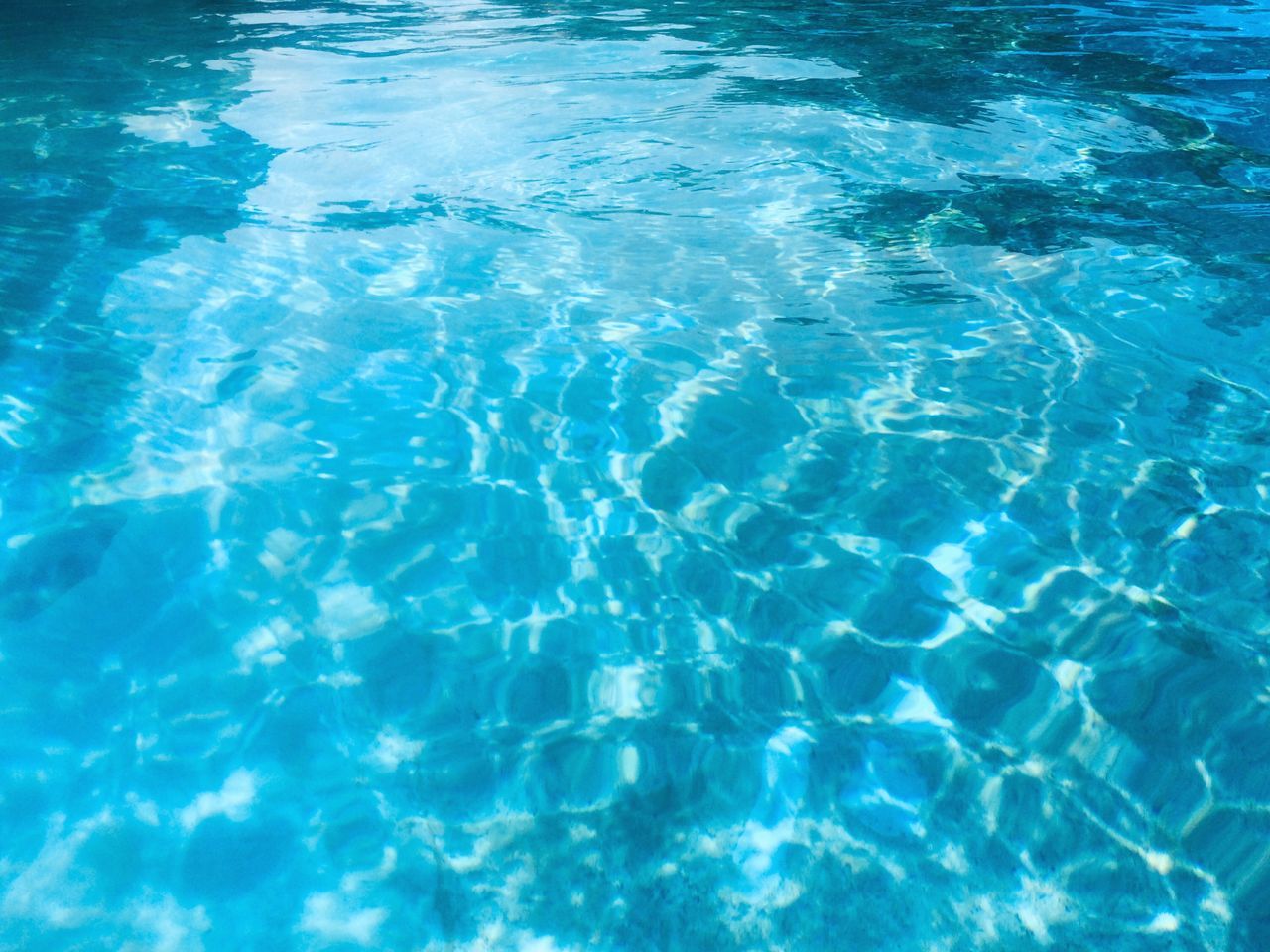 HIGH ANGLE VIEW OF SWIMMING POOL IN WATER