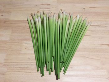 High angle view of lemon grass on wooden table
