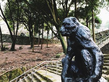 Statue amidst trees in park