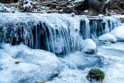 Scenic view of frozen waterfall