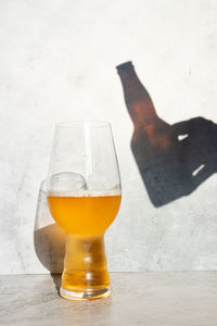 Close-up of beer glass on table