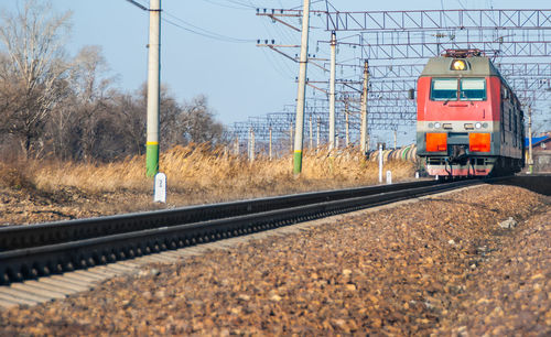 Train on railroad tracks against sky