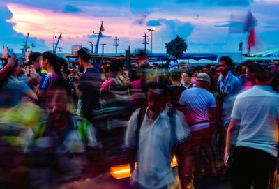 People standing at sunset