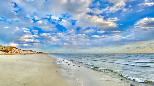 Scenic view of beach against sky