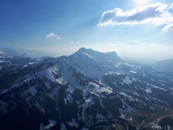 Scenic view of snowcapped mountains against sky