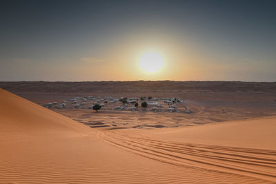 Scenic view of beach against sky during sunset