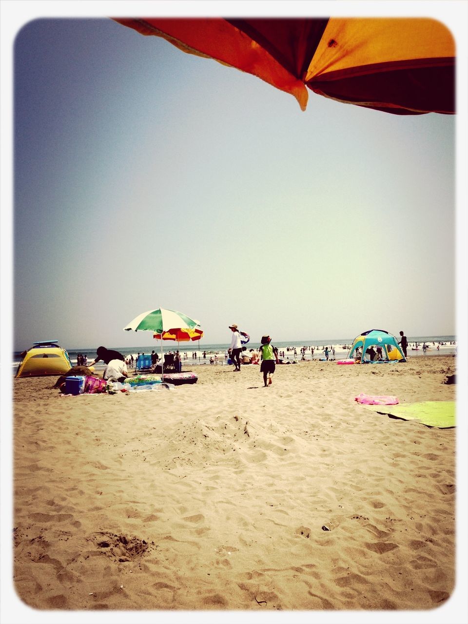 beach, sand, sea, clear sky, shore, transfer print, beach umbrella, horizon over water, vacations, copy space, auto post production filter, parasol, water, summer, sunlight, tranquility, tranquil scene, deck chair, sky, large group of people