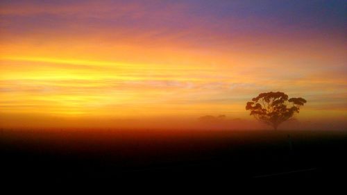 Scenic view of dramatic sky during sunset