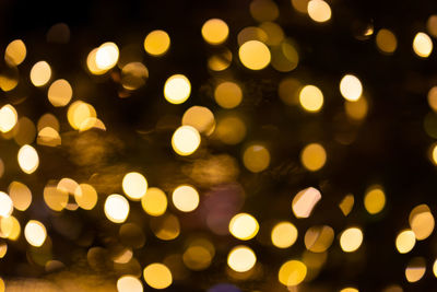 Defocused image of illuminated lights at night