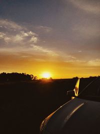 Scenic view of landscape against sky during sunset
