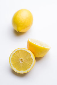 Close-up of lemon slice against white background