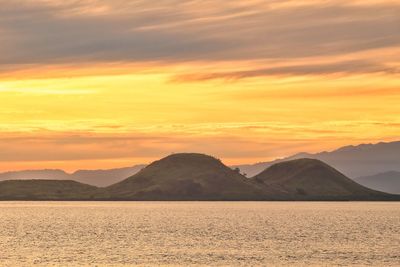 Scenic view of mountains against sky during sunset