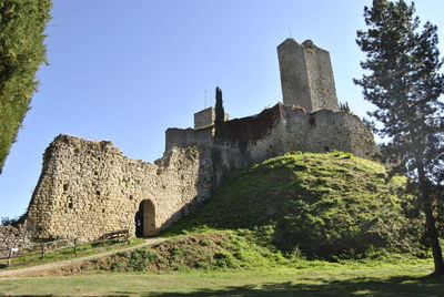 Low angle view of fort against sky