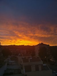 Cityscape against sky during sunset