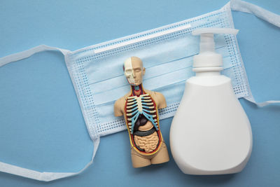 High angle view of dental equipment against blue background