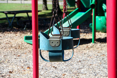 Empty swings and slide at playground