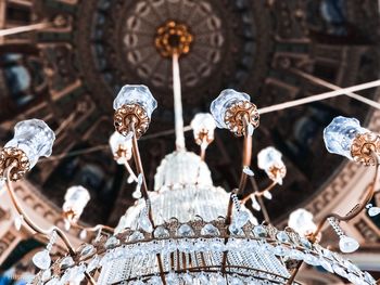 Low angle view of chandelier hanging on ceiling