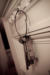 Close-up of house keys on hook at home