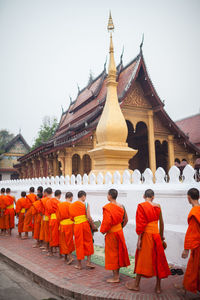 Group of people in temple against building