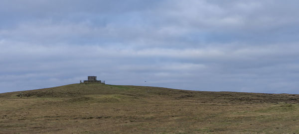 Built structure on land against sky