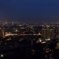 Illuminated cityscape at night