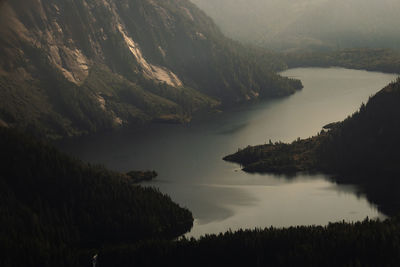 Scenic view of lake and mountains against sky