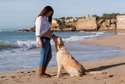 Man with dog at beach