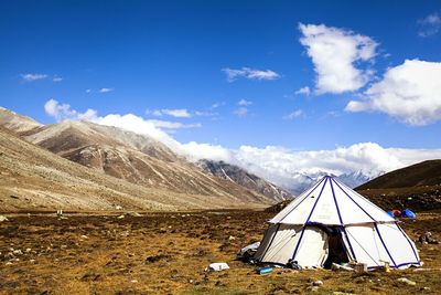 Scenic view of mountains against cloudy sky