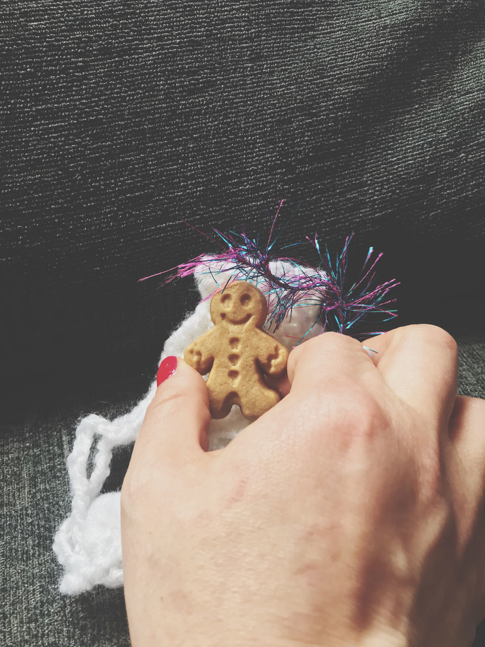 CLOSE-UP OF PERSON HOLDING HAND WITH TATTOO