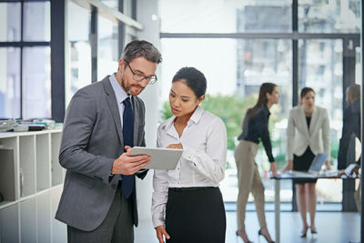 Business colleagues discussing in office