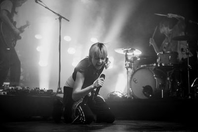 Man playing guitar at music concert