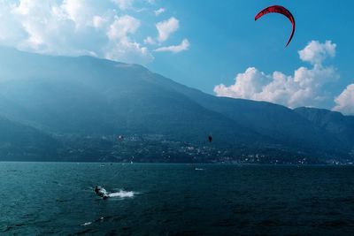 Scenic view of lake and mountains against sky