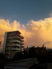 Low angle view of building against sky during sunset