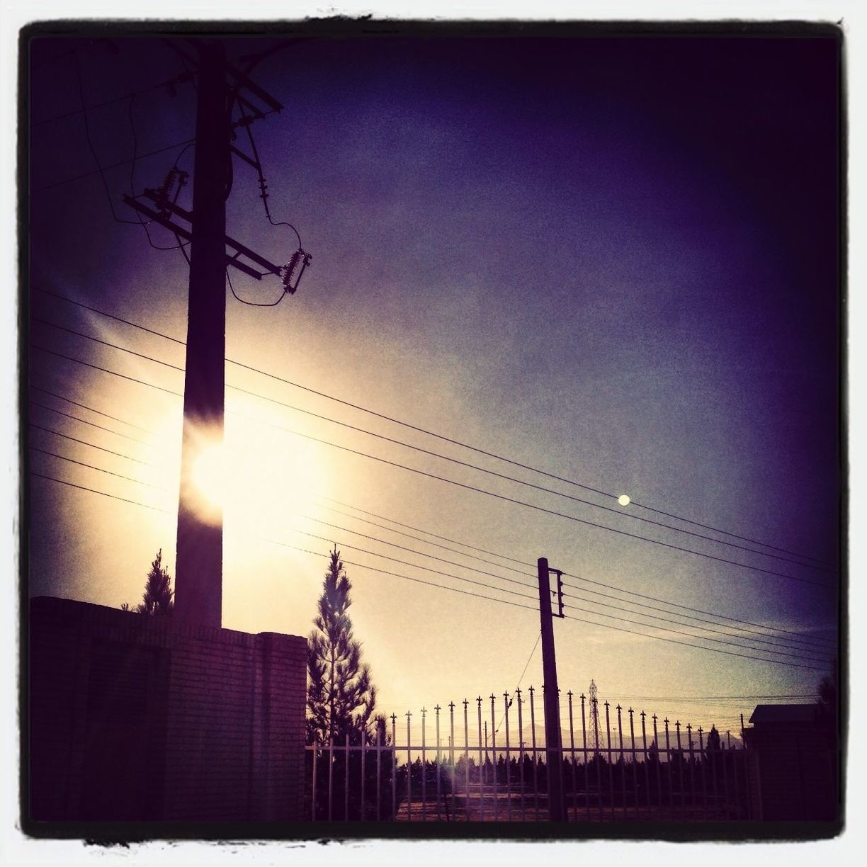 transfer print, auto post production filter, silhouette, sunset, power line, low angle view, electricity pylon, sky, built structure, electricity, sun, connection, power supply, architecture, building exterior, fuel and power generation, power cable, cable, bare tree, nature