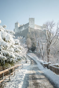 Snow covered fortress hohensalzburg above salzburg, austria