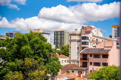 Buildings in city against sky
