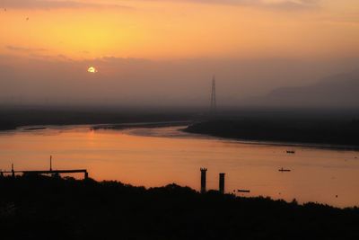 Scenic view of silhouette landscape against sky during sunset