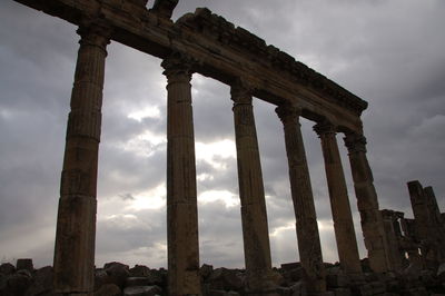 Low angle view of old ruins against sky