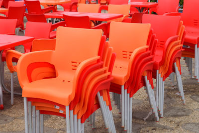 Group of empty arranged chairs  of plastic in row in a restaurant , doldrums, lull, stagnancy 