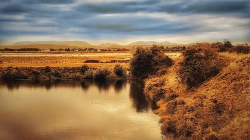 Scenic view of river against sky