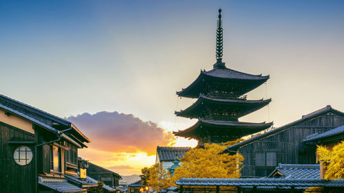 Low angle view of pagoda against sky in city