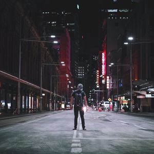 Illuminated city street at night