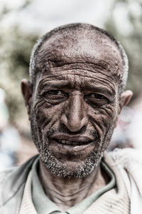 Close-up portrait of man wearing mask outdoors