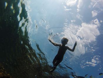 Boy swimming in sea