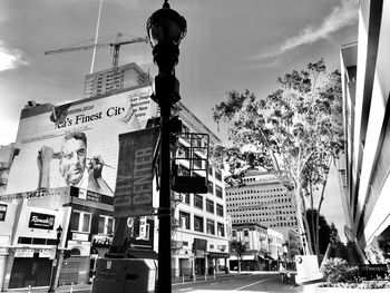 Low angle view of sign on street in city