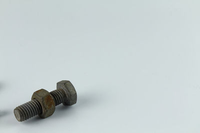 High angle view of chain on table against white background