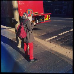 Woman walking on road