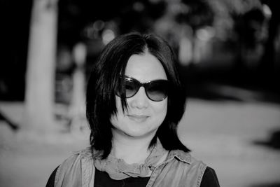 Portrait of woman wearing sunglasses outdoors