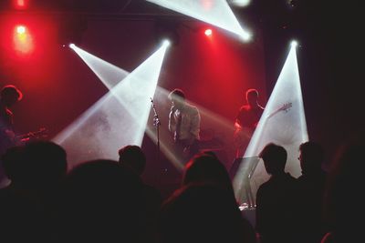 Rear view of people enjoying music concert